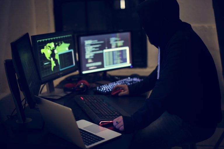 Hacker working using computer with codes